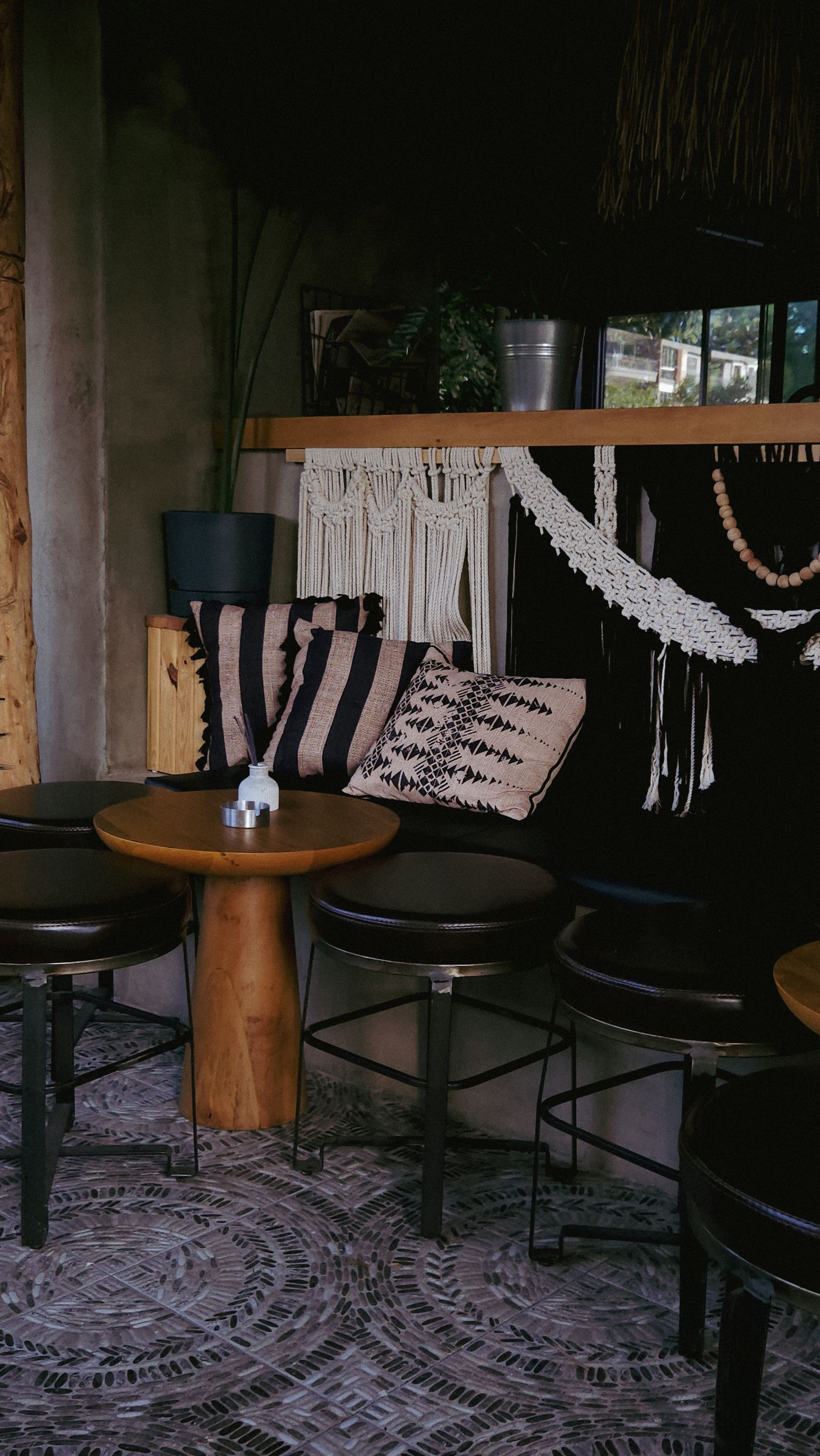 Dark, warm cafe interior with rustic seating